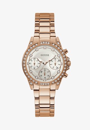 Roségoldene Uhr mit einem Edelstahlarmband, rundem Ziffernblatt, drei Teilzifferblättern und einem mit Kristallen verzierten Lünette um das Ziffernblatt mit Sonnenstrahlenmuster.