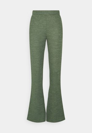 Gröna utsvängda byxor i texturiserat tyg, med hög midja och en figurnära design som vidgar sig vid fållen.