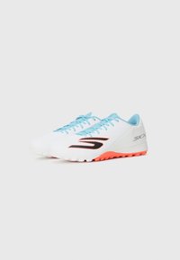 White athletic shoes with light blue laces and accents, featuring a black logo and a textured rubber sole with an orange base.