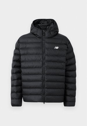 Black puffer jacket with a hood, featuring a zip front, quilted texture, and New Balance logo on the left chest. Smooth, lightweight material.