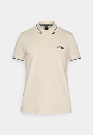 Beige polo shirt made of cotton, featuring a black-trimmed collar, three-button placket, and embroidered "BOSS" logo on the chest.