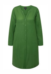 Green button-up dress with long sleeves, made of textured fabric. Features a V-neckline and rounded hem. Buttons run down the front.