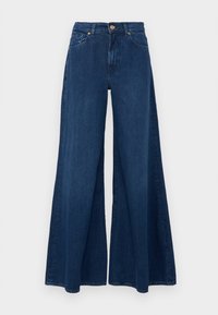 Tummansiniset leveälahkeiset farkut, joissa on korkea vyötärö, kaksi etutaskua ja kultasävyinen kiinnitys nappisuljenta. Sileä rakenne.