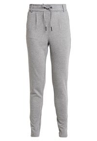 Šedé tepláky vyrobené z měkké tkaniny. Vlastnosti zahrnují stahovací pas, tapered nohavice a boční kapsy s skládáním.