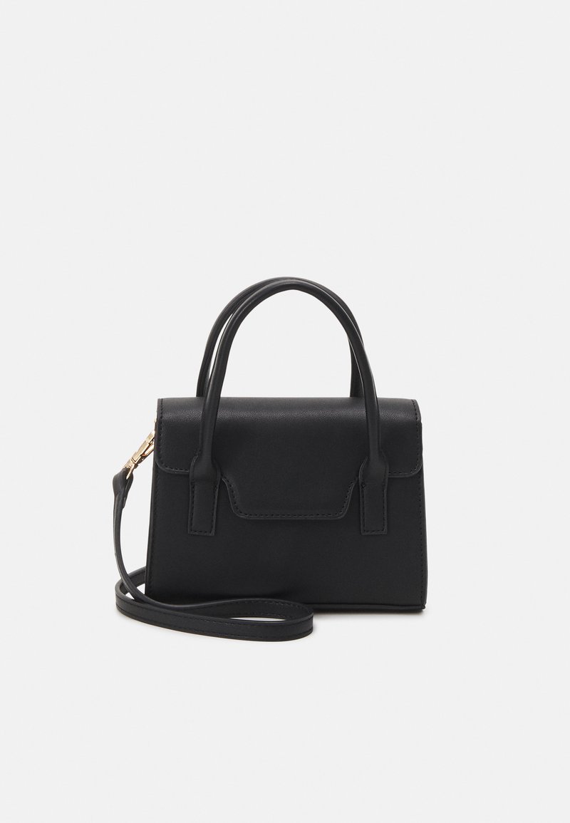 Black structured handbag made of leather with a top handle, detachable shoulder strap, and a front flap detail. Gold hardware accents.