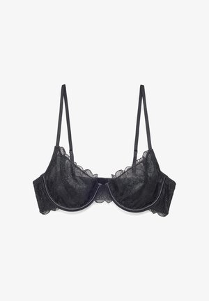 Black lace underwire bra with adjustable thin straps and scalloped edges, designed for support and decorative style.