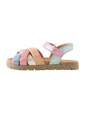 Colorful suede sandals featuring multicolored straps in blue, pink, orange, and green, with a textured beige sole and adjustable ankle strap.
