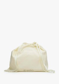 Crème-kleurige trekkoordtas van zacht stof met een gladde textuur, voorzien van twee bijpassende straps en een gedrukt logo aan de voorkant.