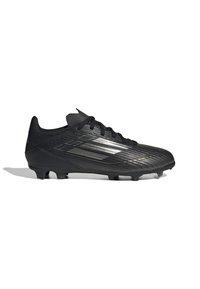 Scarpa da calcio nera con tomaia in mesh testurizzato, design elegante e tacchetti disposti strategicamente per la trazione; presenta strisce metalliche decorative.