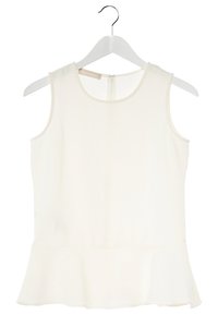 Top blanco sin mangas con escote redondo, bajo peplum y acabado sutilmente texturizado. Se abrocha por la espalda con una cremallera.