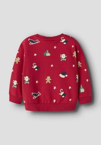 Roter Pullover mit einem festlichen Druck von Santa Claus, Lebkuchenmännern, Schlitten und Sternen, mit gerippten Bündchen und Saum.