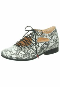 Scarpa con lacci, dal motivo astratto in bianco e nero. Parte superiore in tessuto leggero, lacci neri e tacco basso. Le aperture sui lati aggiungono dettaglio.