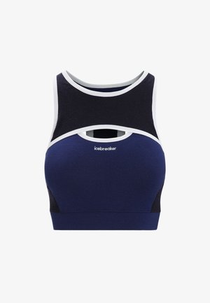Navy blue sports bra with white accents, featuring a cut-out design above the bust. Made from stretchy material, it offers a fitted structure.