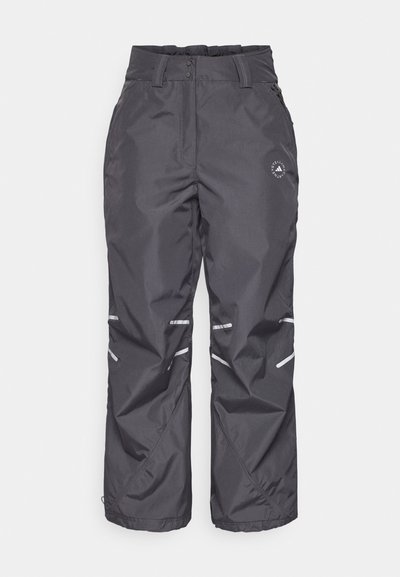 Γκρι αδιάβροχα παντελόνια χιονιού με χαλαρή εφαρμογή, ρυθμιζόμενη μέση, ανακλαστικές ρίγες και λογότυπο στο αριστερό μηρό. Εξαντλημένη υφή.