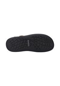 Black rubber shoe sole featuring a textured tread pattern with diamond-shaped grooves for grip. Smooth finish with a logo detail.