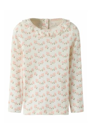 Haut à manches longues léger à côtes en crème avec un motif floral rose et vert. Présente un col froncé et une fermeture à boutons au dos.