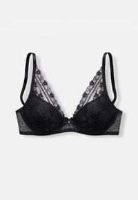 Soutien-gorge en dentelle noire avec une forme triangulaire, un bord en dentelle décorative, un soutien sous-armature et des bretelles en satin réglables. Comprend un petit détail de gemme à l'avant.