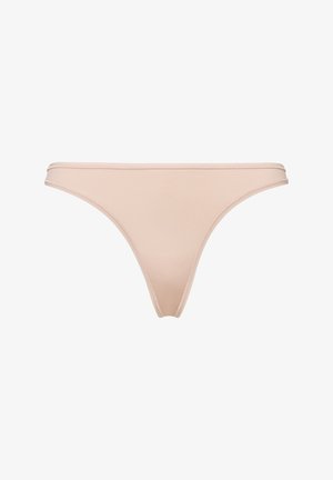 Beige thong made of smooth fabric, featuring a minimalistic design with thin elastic waistband and edges, offering a seamless look.