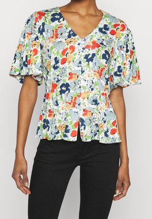 Bloemrijke peplum blouse met een V-hals, versierd met groen, blauw, rood en oranje patronen op een lichte achtergrond. Korte puffmouwen.