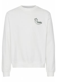 Hvit sweatshirt laget av bomull, med rund hals, lange ermer, ribbestrikkede mansjetter og et grønt grafikkmotiv av en potteplante på brystet.