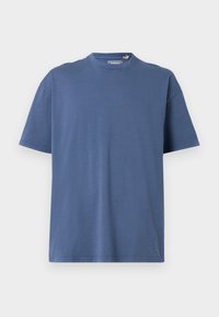T-shirt azul de mangas curtas feito de algodão macio, com decote redondo e um ajuste confortável, apresentando mínimos detalhes de costura.