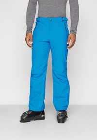 Pantalons de ski bleu vif fabriqués à partir d'un tissu durable, avec un design à jambe droite, dotés d'une fermeture à bouton et de poches zippées.