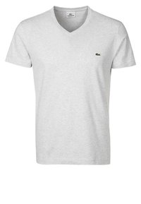 Gray v-neck t-shirt made of soft cotton, featuring a small green Lacoste logo on the left chest. Simple design, short sleeves, casual fit.
