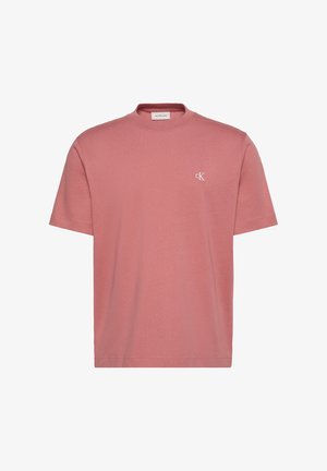 T-shirt rosa polvere a maniche corte con scollo rotondo e piccolo logo bianco "cK" sul petto sinistro di Calvin Klein Jeans.