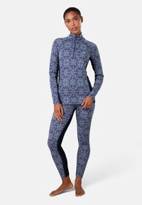 Marineblauwe, langlijf-topt met een halve ritssluiting en bijpassende legging met zijaccenten in een donkerder stof. Soepele, rekbare stof.