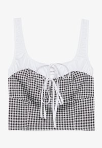 Top corto de gingham en blanco y negro con tirantes rizados blancos y un detalle de lazo en la parte delantera. Presenta una silueta ajustada con textura fruncida.