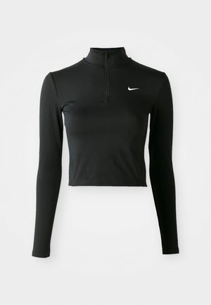 Czarny, długi rękaw, skrócony top sportowy z kołnierzykiem na pół zamek i białym logo Nike na lewej piersi. Gładki, elastyczny materiał.