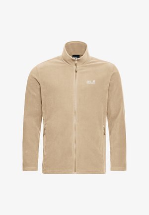 Veste en polaire beige avec un col montant, une fermeture éclair intégrale et deux poches latérales. Présente un logo sur la poitrine gauche. Texture lisse.