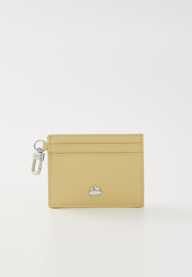 Yellow leather cardholder with a smooth texture, featuring a metal clasp and a small logo accent on the front. Two card slots on top.