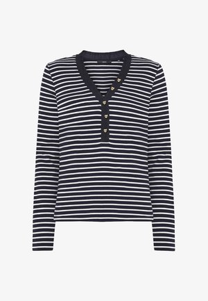 Marineblå og hvide stribet langærmet skjorte med V-hals og fem små hjerteformede knapper langs halsudskæringen.