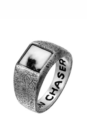 Square silver-tone ring with textured surface and black-and-white stone inlay; engraved with the word "CHASER" inside the band.