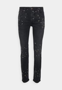 Černé džíny z denimu se slim fit střihem, s barevnými skvrnami v bílé a zlaté barvě. Pětipocket design s knoflíkovým a zipovým zapínáním.