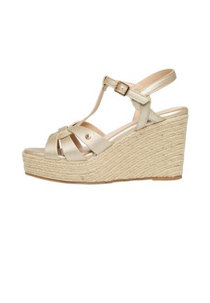 Sandaal met sleehak espadrille met gouden leren bandjes, T-band ontwerp, verstelbare gesp en gevlochten jute plateauzool.