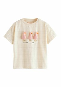 Kortärmad krämfärgad T-shirt med rutmönster, prydd med tre rosa anka-applikationer och svart text som står "ALLTID NYFIKEN."