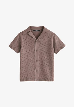 Kratki smeđi pamučni kardigan s cik-cak uzorkom, šiljastim ovratnikom i gumbima sprijeda, s etiketom "NEXT" unutar ovratnika.