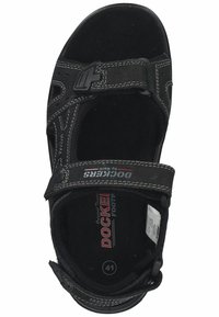 Schwarze Sandale mit verstellbaren Riemen, Gummisohle und gepolstertem Fußbett. Mit weißer Nähte und Logodetails auf dem Fußbett. Größe 41.