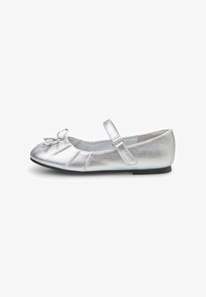 Silver metallic ballet flats with a textured finish, rounded toe, gathered detailing, and an adjustable strap across the ankle.