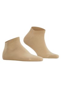 Calze alla caviglia beige realizzate in materiale liscio e elastico. Presentano un polsino a coste e un design senza cuciture per il massimo comfort.