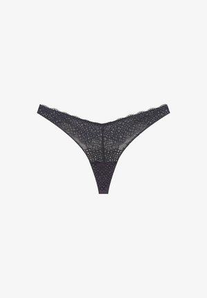 Lace thong in dark gray, featuring a sheer design with dotted patterns. Delicate, textured fabric with a curved waistband and minimal coverage.