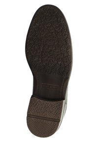 Suela de zapato de goma marrón con una superficie texturada y con patrón, un leve tacón y el nombre de la marca "JOSEF SEIBEL" grabado.