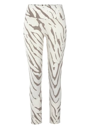 Leggings realizzati in morbido tessuto, con una base bianca e audaci strisce di zebra marroni ondulate, vita alta e una texture liscia.