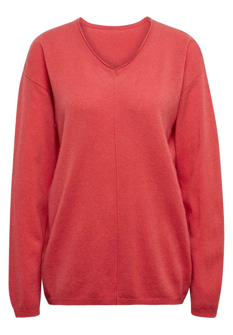 Pull en tricot corail avec un col en V, des manches longues et des poignets côtelés. Il présente une texture lisse et un léger motif vertical.