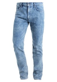 Ljusblå denimjeans med rak bendesign, utrustade med en klassisk femficksstil och en dragkedja med metallknäppning.