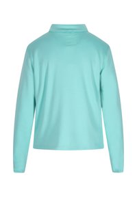 Langærmet polo shirt i lys turkis, lavet af glat stof med klassisk krave og en afslappet pasform. Bagudsigt viser ingen yderligere detaljer.