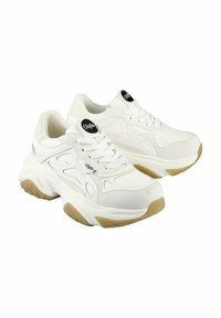 White sneakers with textured synthetic material, padded tongue, and lace closure. Features cutout design, contoured sole, and gum rubber accents.