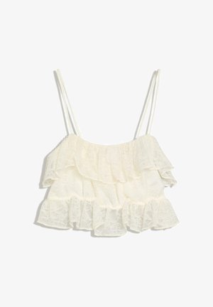 Witte kanten crop top met dubbele dunne schouderbandjes en gelaagde ruches langs de halslijn en zoom.